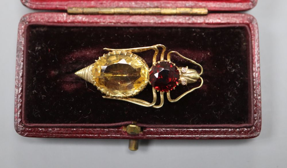 A yellow metal (tests as high carat), garnet and citrine set bug brooch, with diamond set eyes, 33mm, gross 3.1 grams.